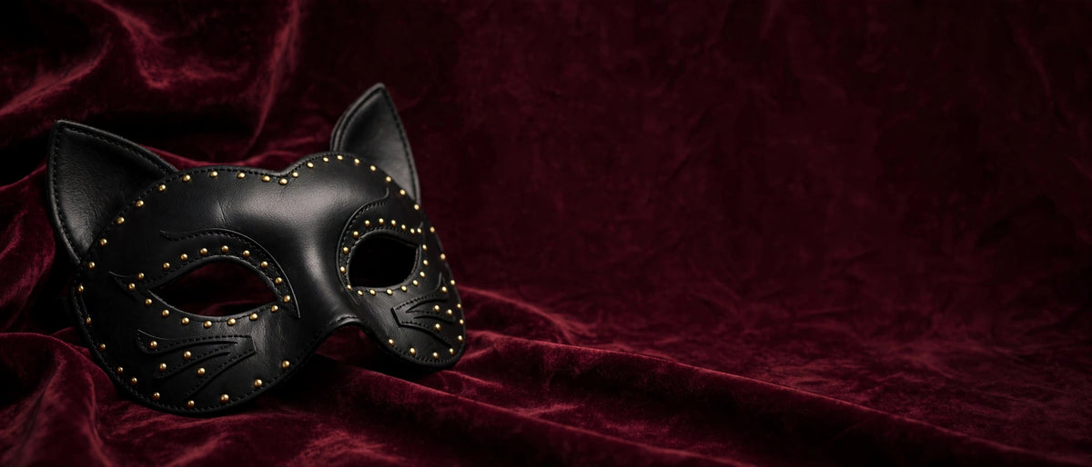 Black masquerade cat mask on burgundy velvet - Red Velvet Boutique